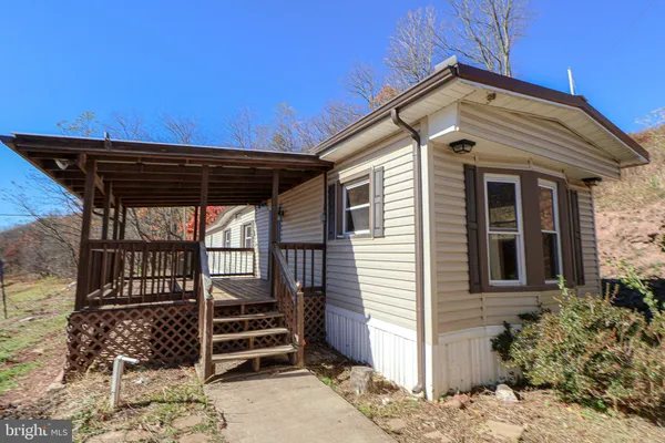 a front view of a house with a porch