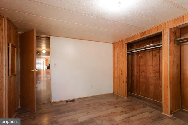 a view of wooden floor and living room