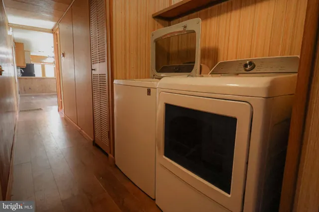 a view of an entryway with wooden floor