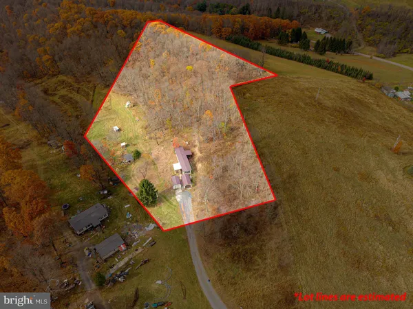 a aerial view of a house with a yard