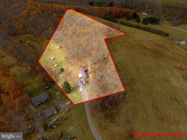 a aerial view of a house with a yard