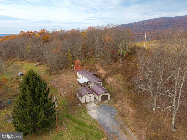 an aerial view of residential house with outdoor space