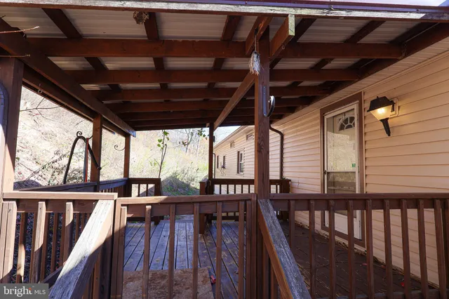 a view of a balcony with wooden floor