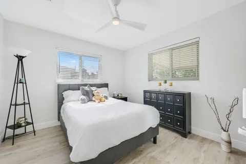 a bedroom with a bed and a table