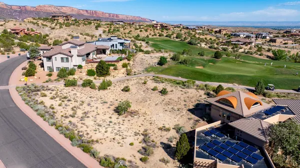 an aerial view of a house with a ocean view