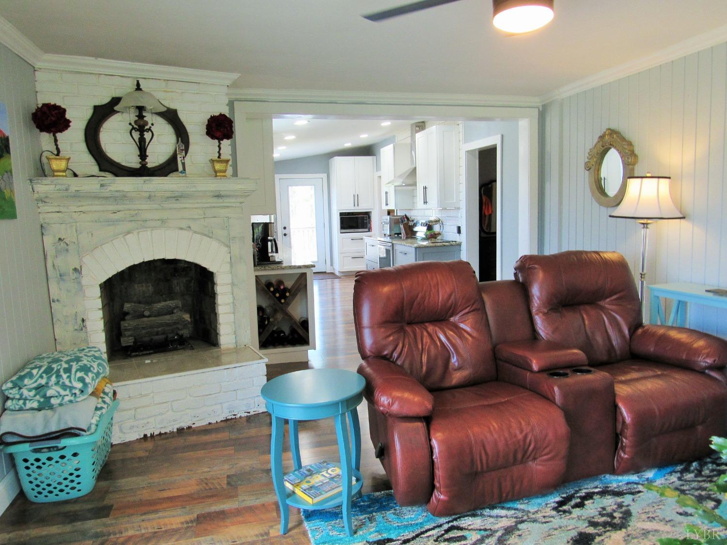 241 Hanger Road Amherst, VA 24521 - Photo 14 of 51 a living room with furniture and a fireplace