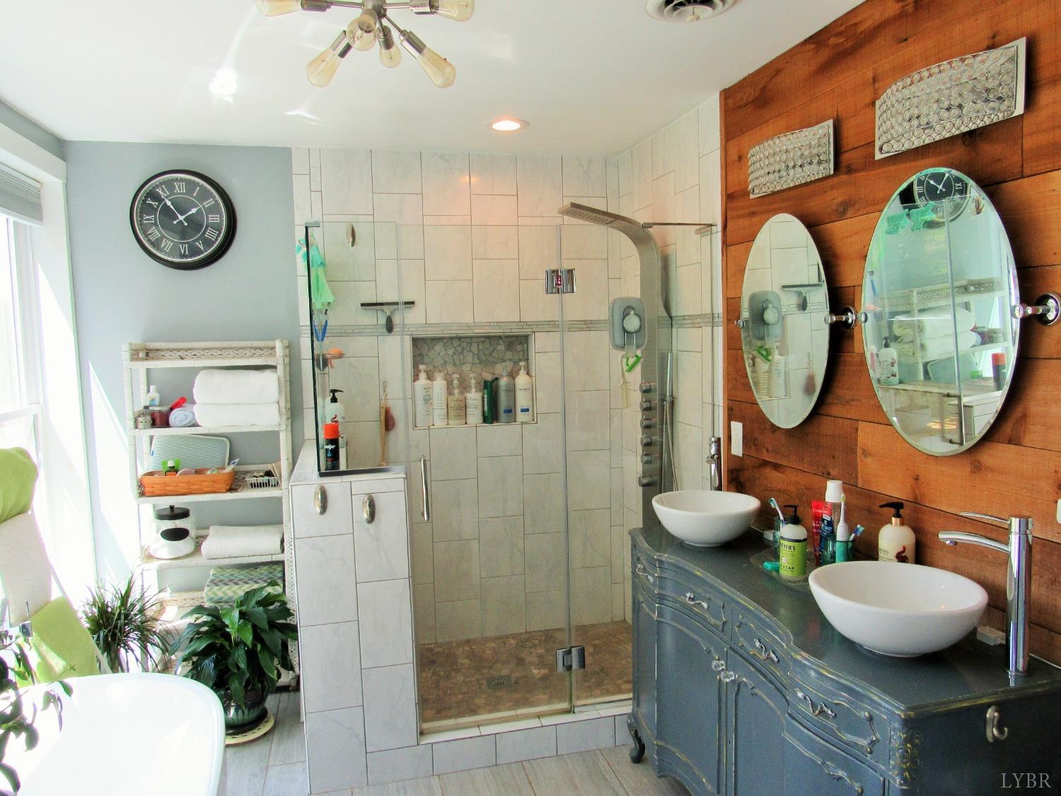 241 Hanger Road Amherst, VA 24521 - Photo 18 of 51 a bathroom with a granite countertop sink mirror and vanity