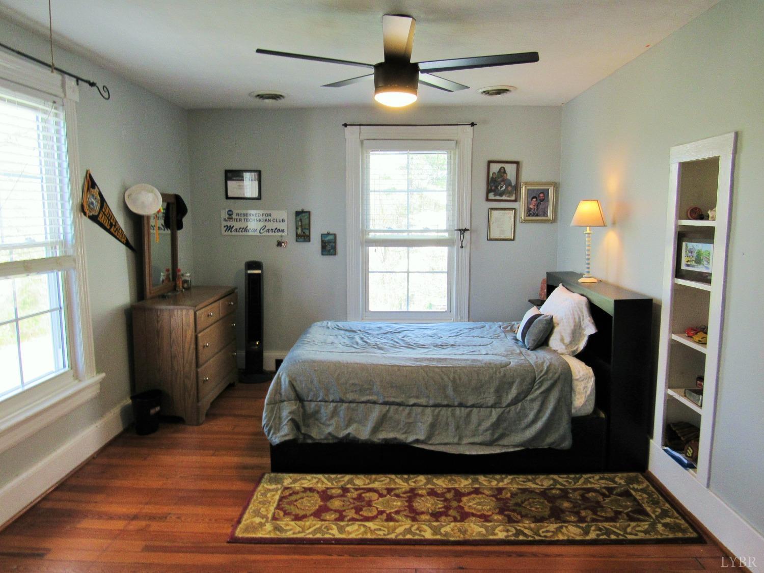241 Hanger Road Amherst, VA 24521 - Photo 25 of 51 a bedroom with a bed and wooden floor