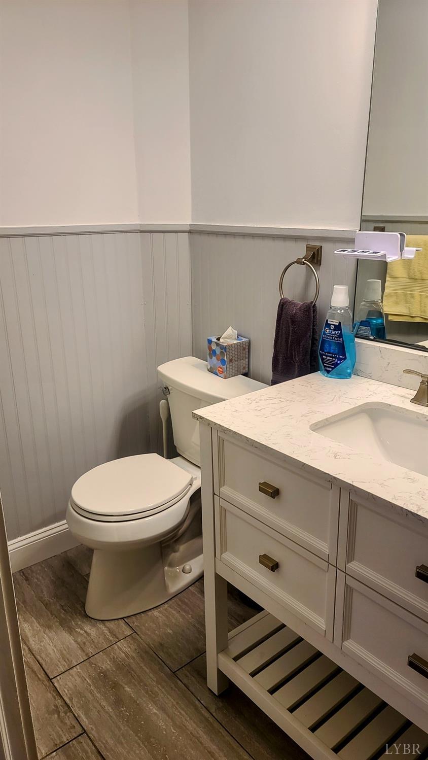 241 Hanger Road Amherst, VA 24521 - Photo 29 of 51 a bathroom with a sink a toilet and mirror