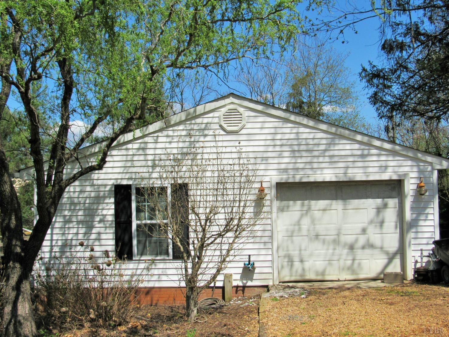 241 Hanger Road Amherst, VA 24521 - Photo 43 of 51 a white house with tree in front of it