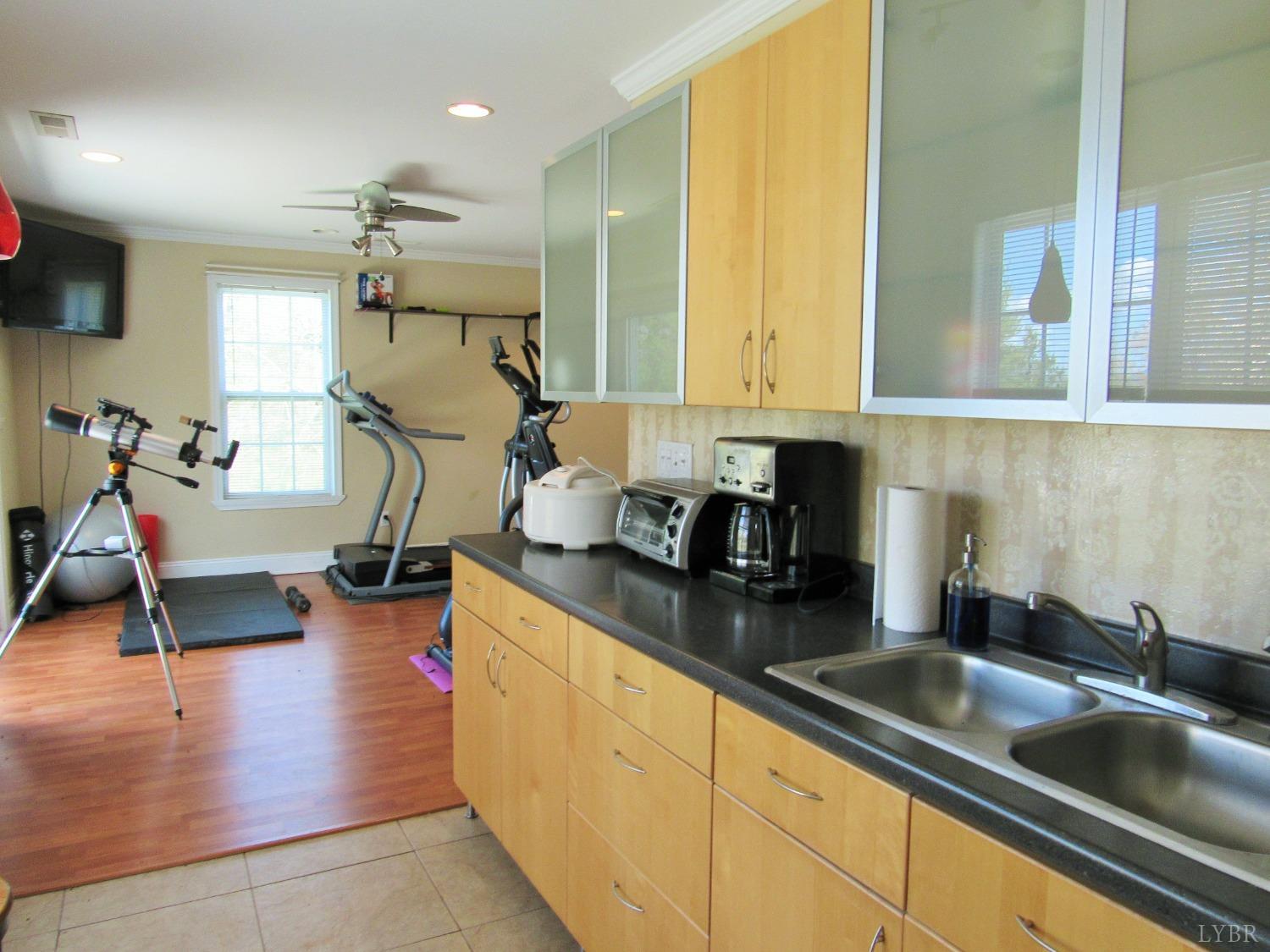 241 Hanger Road Amherst, VA 24521 - Photo 44 of 51 a kitchen with sink refrigerator and window