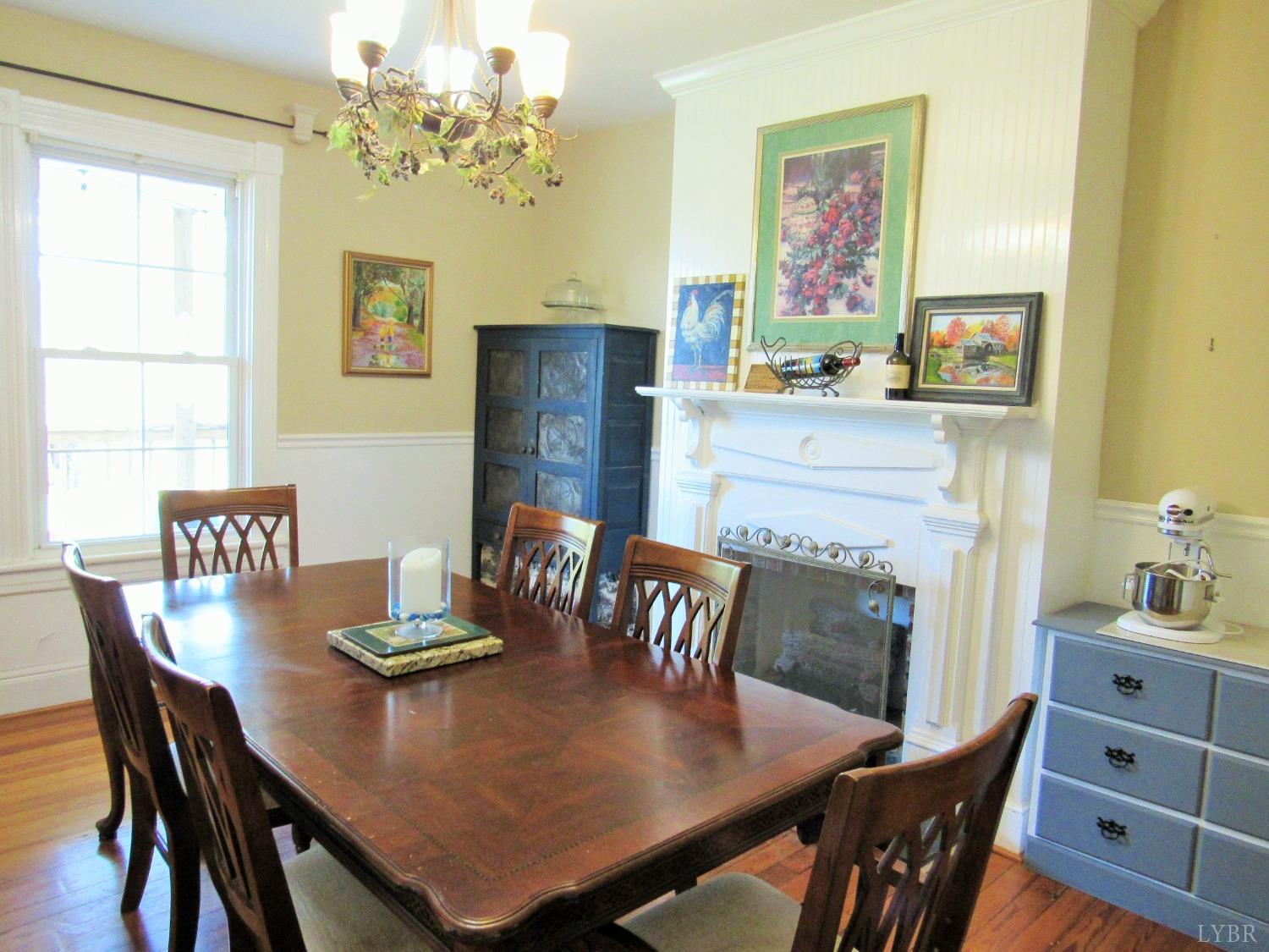 241 Hanger Road Amherst, VA 24521 - Photo 8 of 51 a view of a dining room with furniture a chandelier and wooden floor