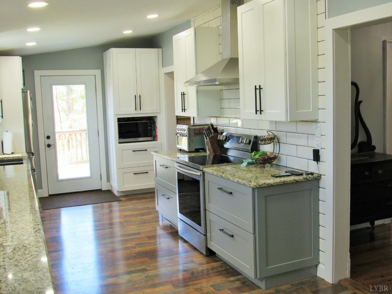 241 Hanger Road Amherst, VA 24521 - Photo 10 of 51 a kitchen with a stove and a sink