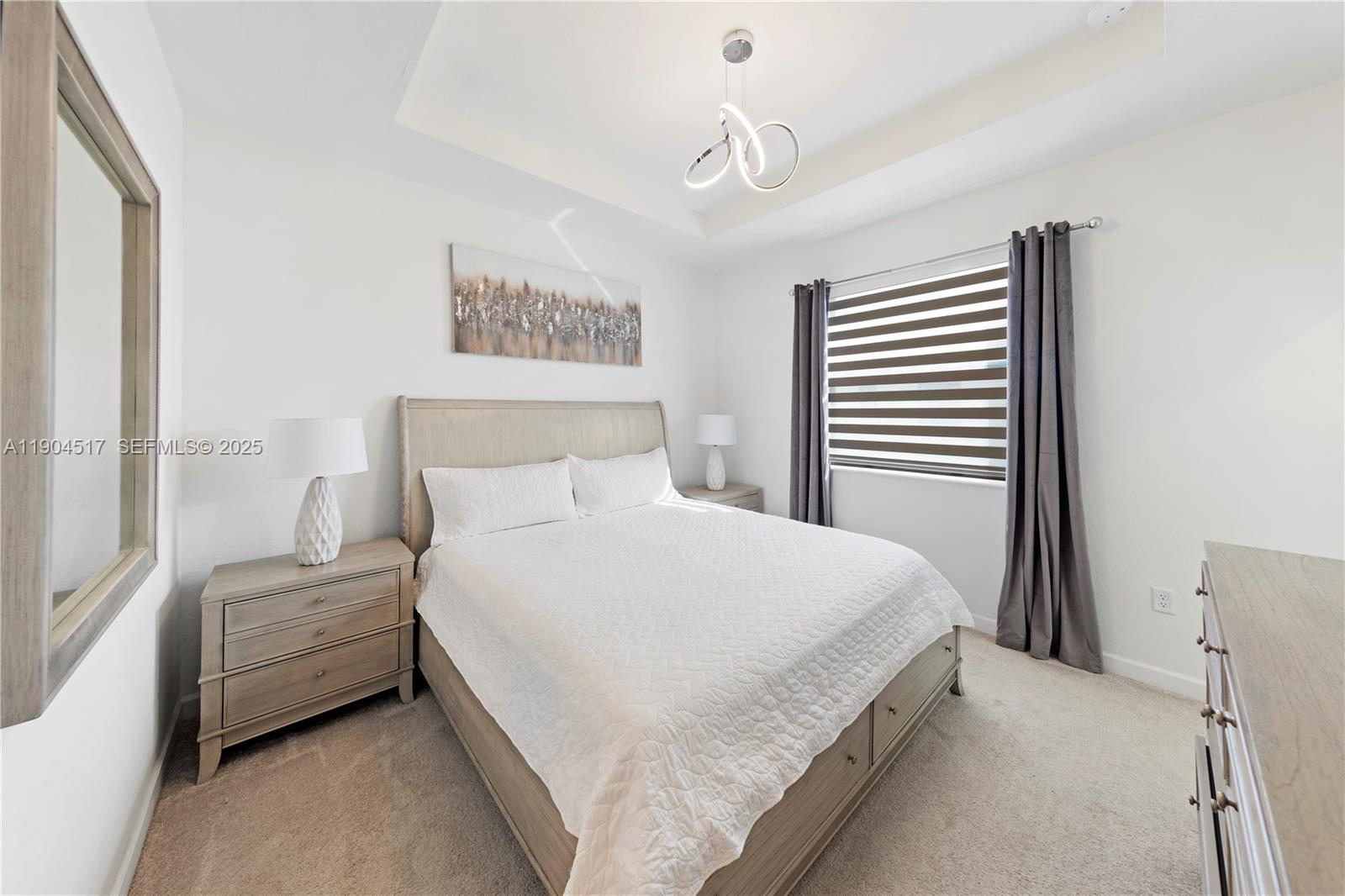 12942 Southwest 232nd Terrace Homestead, FL 33032 - Photo 11 of 27 a bedroom with a bed and a window