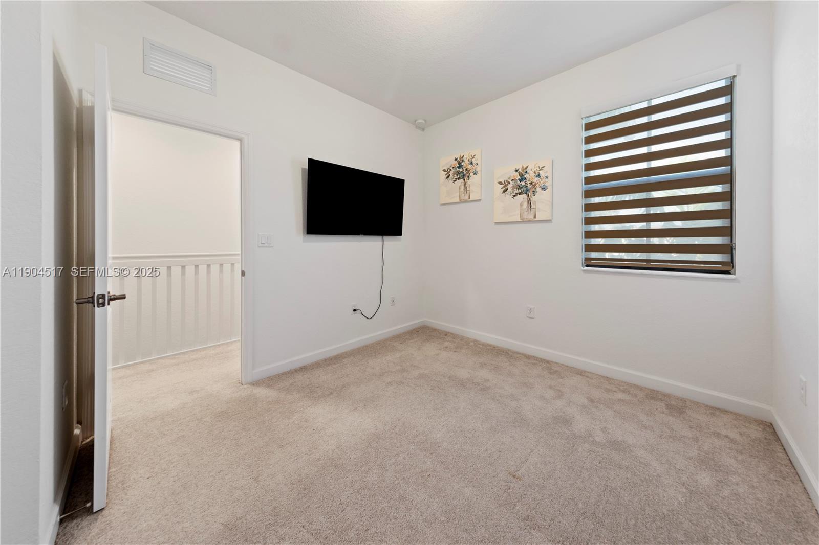 12942 Southwest 232nd Terrace Homestead, FL 33032 - Photo 15 of 27 a view of livingroom with furniture and a flat screen tv