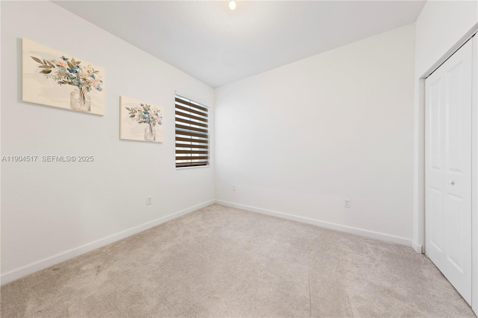 12942 Southwest 232nd Terrace Homestead, FL 33032 - Photo 16 of 27 an empty room with windows