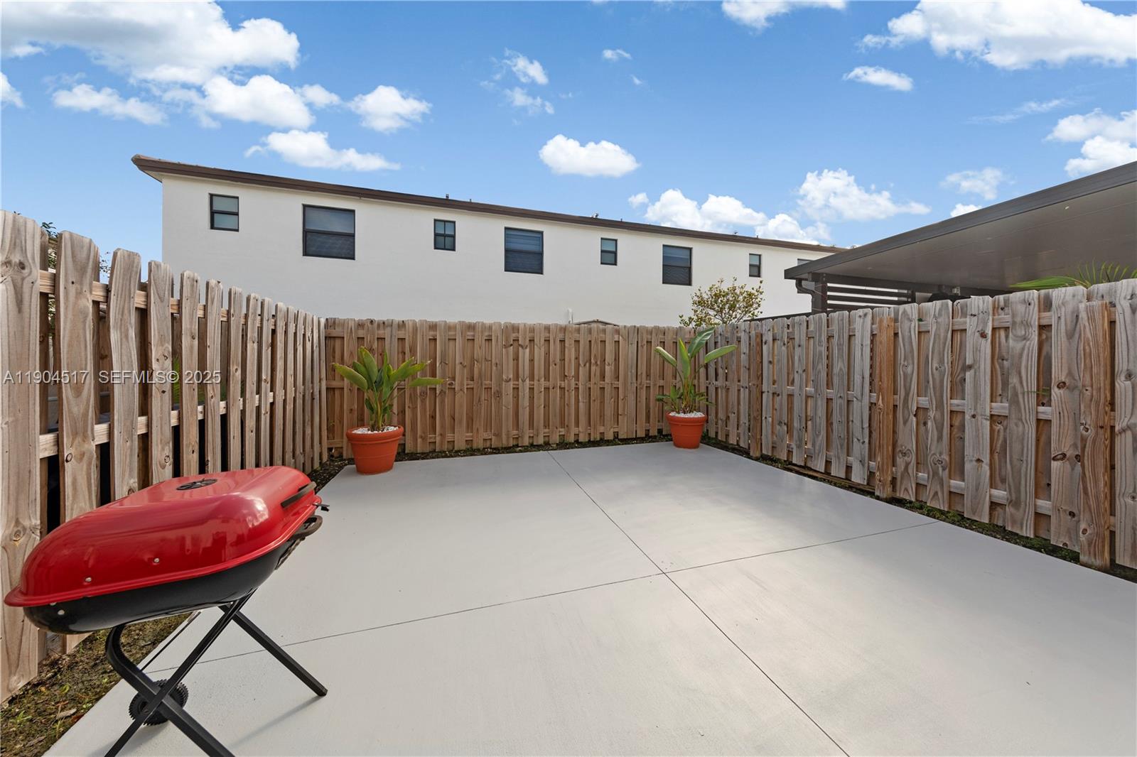 12942 Southwest 232nd Terrace Homestead, FL 33032 - Photo 18 of 27 a view of a porch with furniture and a yard