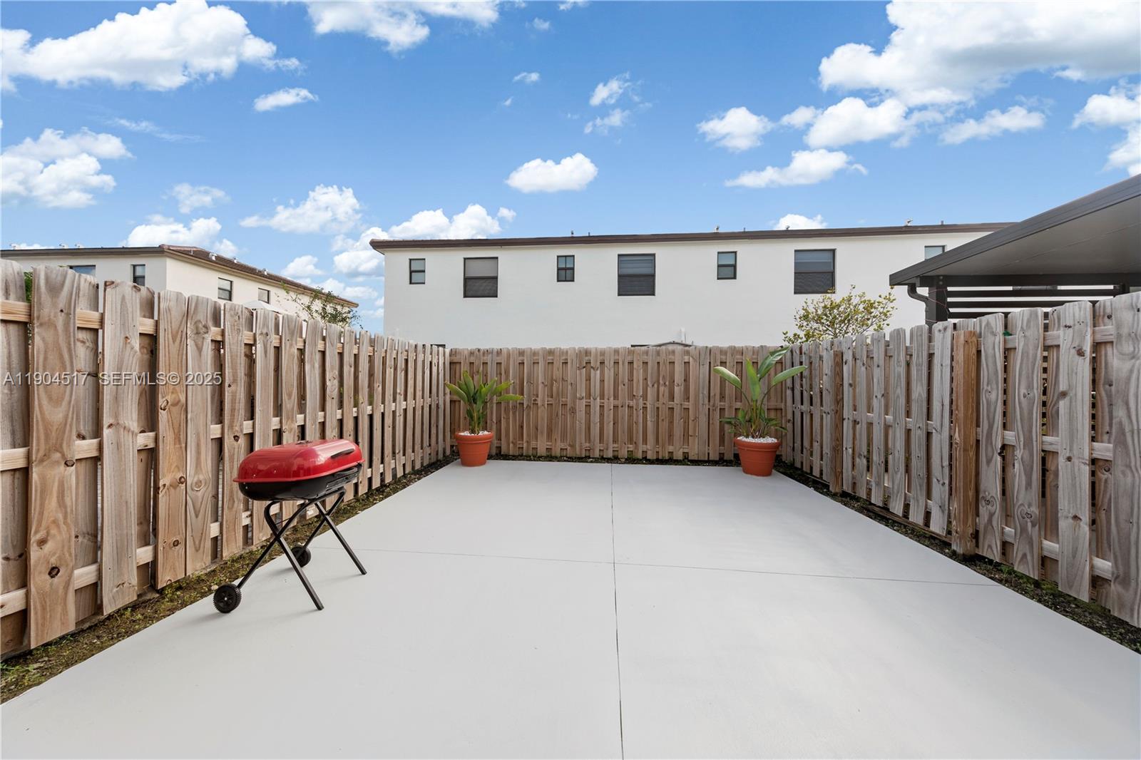 12942 Southwest 232nd Terrace Homestead, FL 33032 - Photo 19 of 27 a view of a porch with a bench
