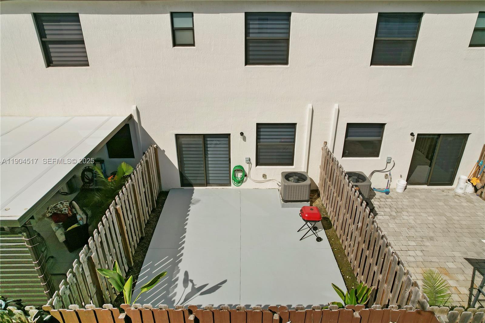 12942 Southwest 232nd Terrace Homestead, FL 33032 - Photo 26 of 27 a view of a livingroom with furniture and a flat screen tv