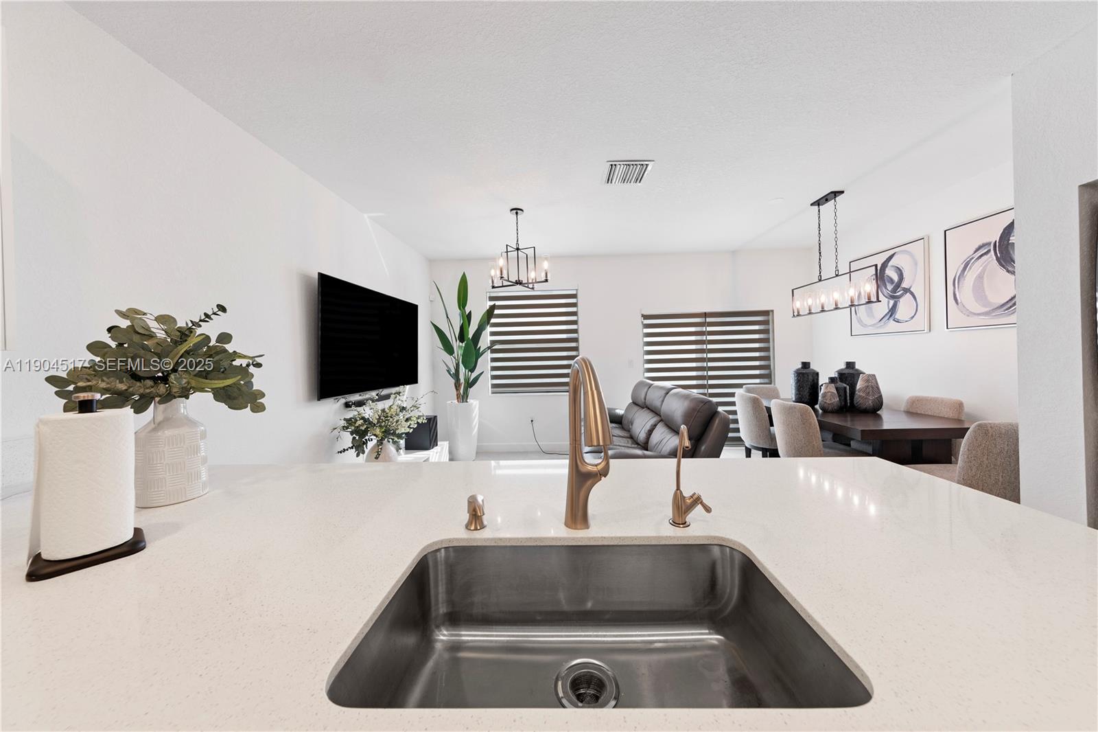 12942 Southwest 232nd Terrace Homestead, FL 33032 - Photo 5 of 27 a bathroom with a sink and a mirror