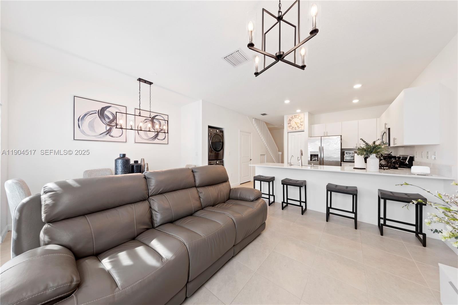 12942 Southwest 232nd Terrace Homestead, FL 33032 - Photo 10 of 27 a living room with furniture and kitchen view