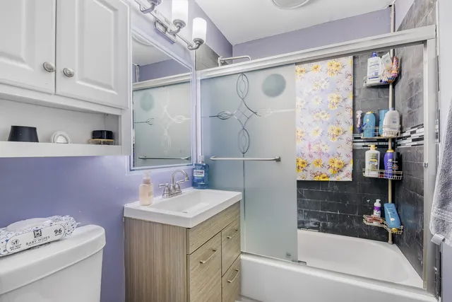 a bathroom with a sink a bath tub and a shower