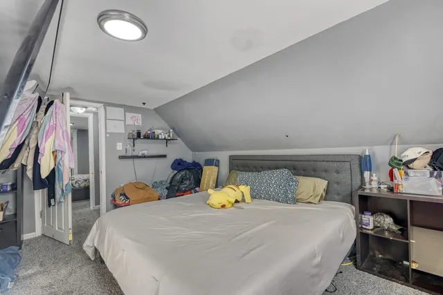 a living room with lots of walk in closet and clothes