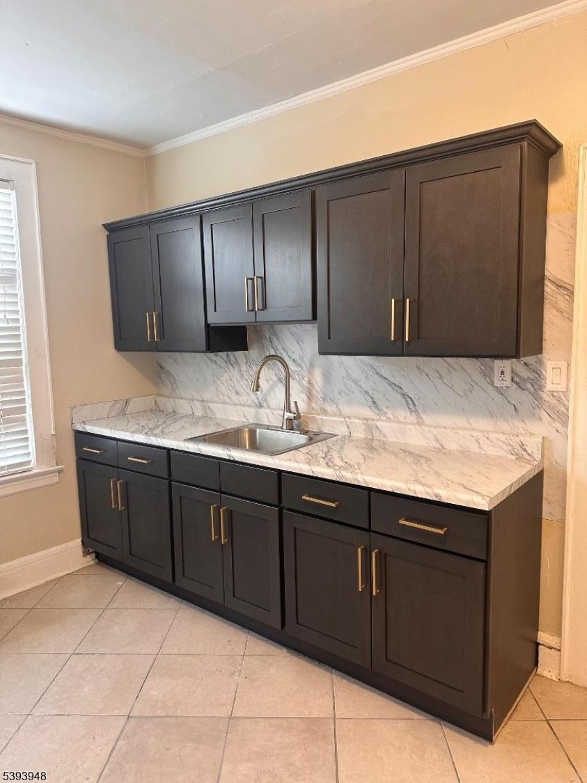 25 Union Place, Unit 1L Irvington, NJ 07111 - Photo 5 of 12 a bathroom with a granite countertop sink and vanity