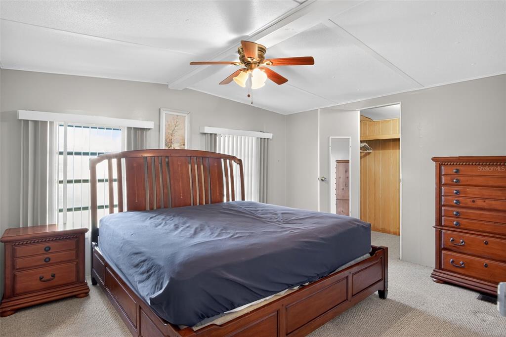 17536 Brinkerhoff Lane Okeechobee, FL 34974 - Photo 12 of 17 a bedroom with a bed and a dresser