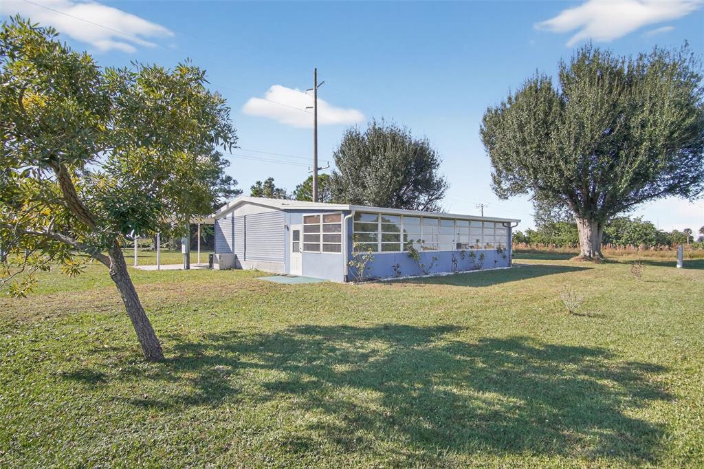 17536 Brinkerhoff Lane Okeechobee, FL 34974 - Photo 2 of 17 a view of a house with a yard