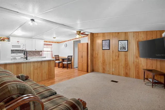 a bedroom with a bed and flat screen tv
