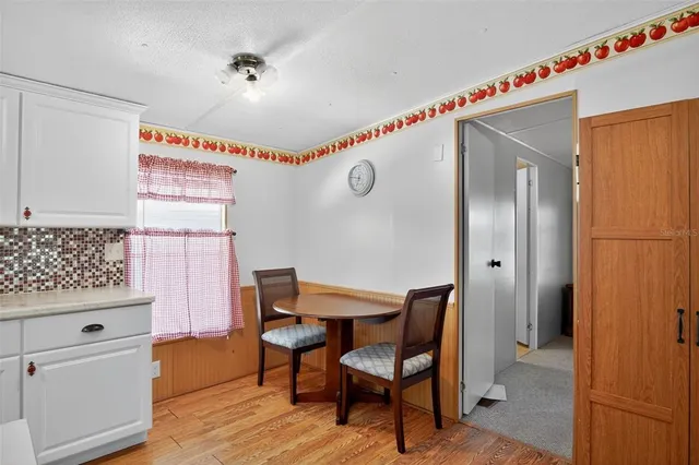 a kitchen with a table and chairs