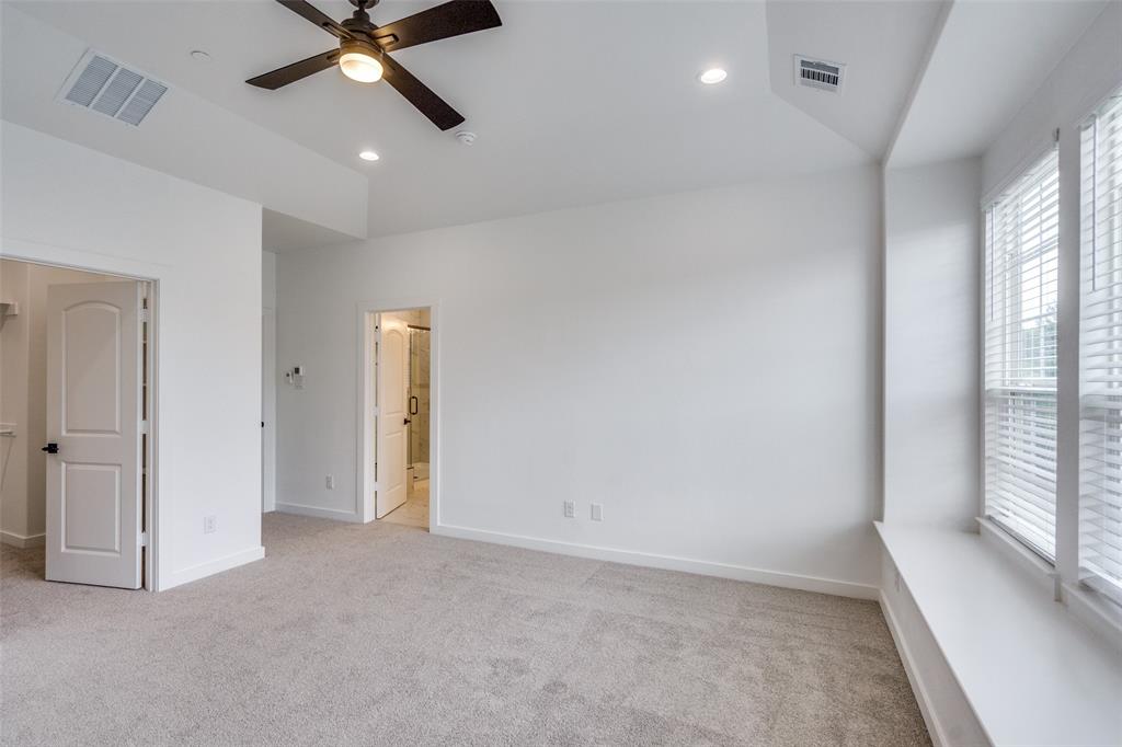 7207 Switchgrass Road Frisco, TX 75033 - Photo 19 of 26 an empty room with windows and fan