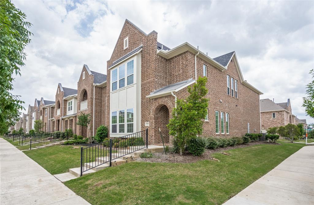 7207 Switchgrass Road Frisco, TX 75033 - Photo 2 of 26 a view of a brick building next to a yard