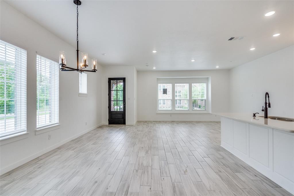 7207 Switchgrass Road Frisco, TX 75033 - Photo 7 of 26 a view of a room with window and wooden floor