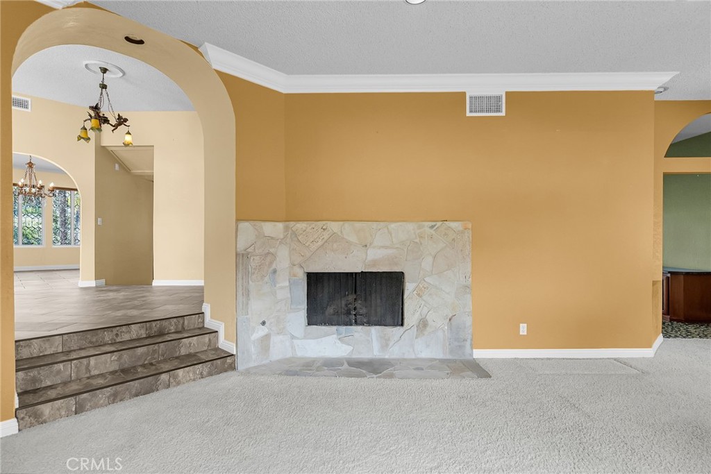 1249 Coronet Drive Riverside, CA 92506 - Photo 15 of 57 a view of livingroom and fireplace
