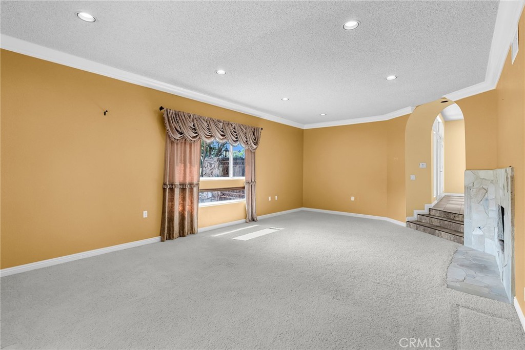 1249 Coronet Drive Riverside, CA 92506 - Photo 16 of 57 a view of an empty room with a window