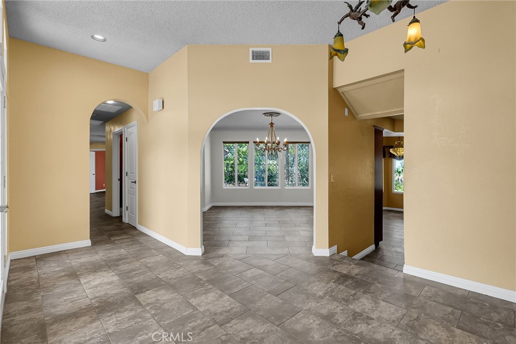 1249 Coronet Drive Riverside, CA 92506 - Photo 17 of 57 an empty room and a window in a room