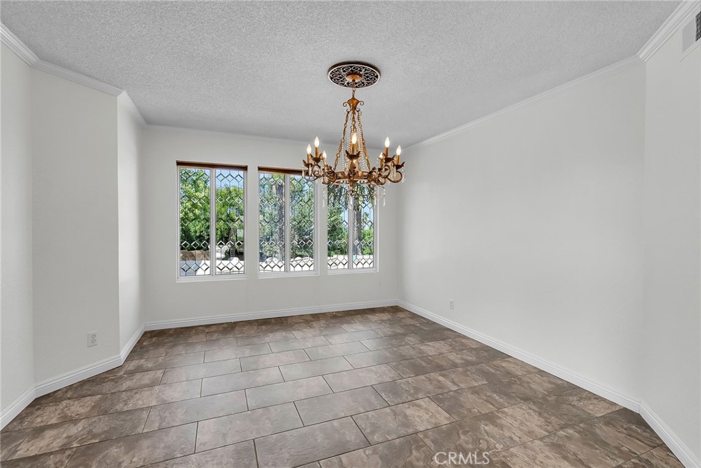 1249 Coronet Drive Riverside, CA 92506 - Photo 18 of 57 a view of an empty room with window