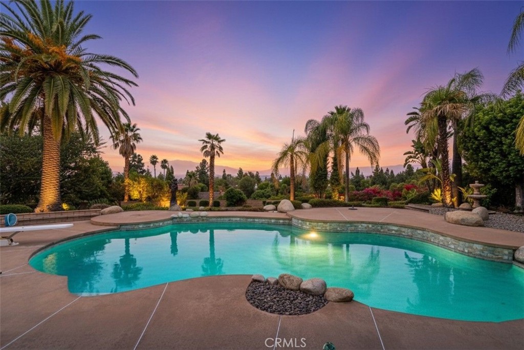 1249 Coronet Drive Riverside, CA 92506 - Photo 2 of 57 a view of a lake with a yard