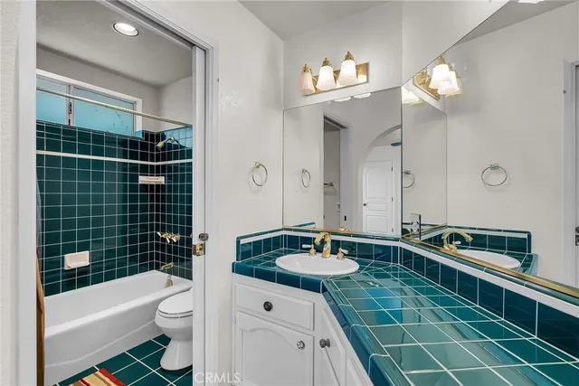 a view of a patio with a table and chairs