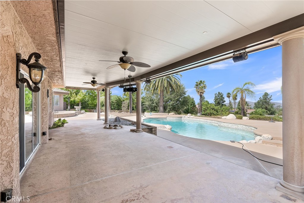 1249 Coronet Drive Riverside, CA 92506 - Photo 36 of 57 a view of a patio with a table and chairs