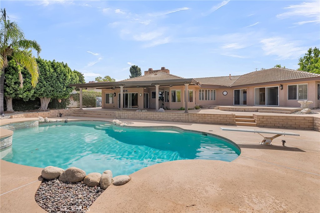 1249 Coronet Drive Riverside, CA 92506 - Photo 40 of 57 a view of a house with a backyard porch and sitting area