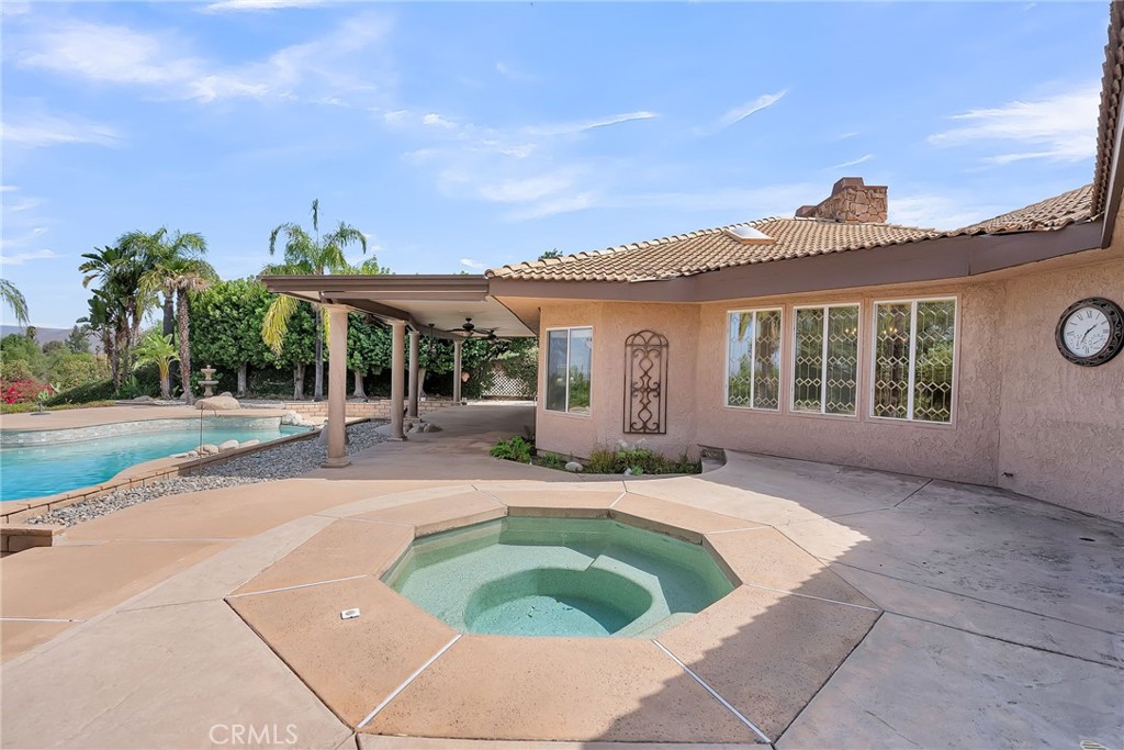 1249 Coronet Drive Riverside, CA 92506 - Photo 43 of 57 a view of house with swimming pool and outdoor seating