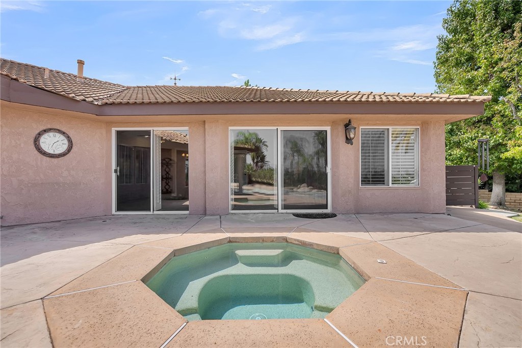 1249 Coronet Drive Riverside, CA 92506 - Photo 44 of 57 a house with swimming pool in front of it