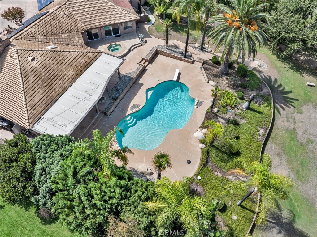 1249 Coronet Drive Riverside, CA 92506 - Photo 53 of 57 an aerial view of a house with garden space and swimming pool