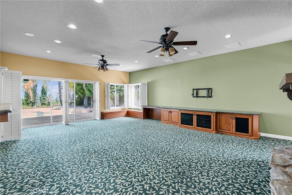1249 Coronet Drive Riverside, CA 92506 - Photo 7 of 57 a living room with a large window