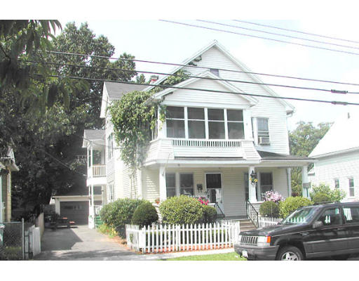 118-20 Draper Street Springfield, MA 01108 - Photo 1 of 1 a front view of a house with a yard