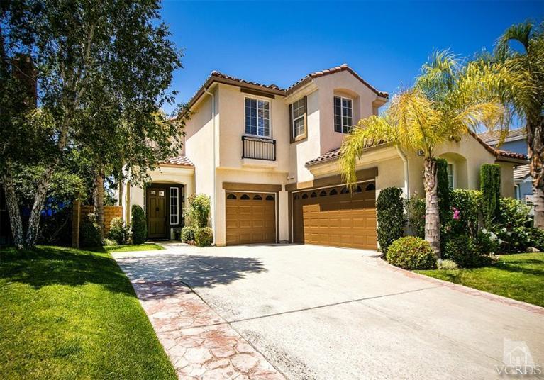 14303 Peach Hill Road Moorpark, CA 93021 - Photo 2 of 41 a front view of a house with a garden