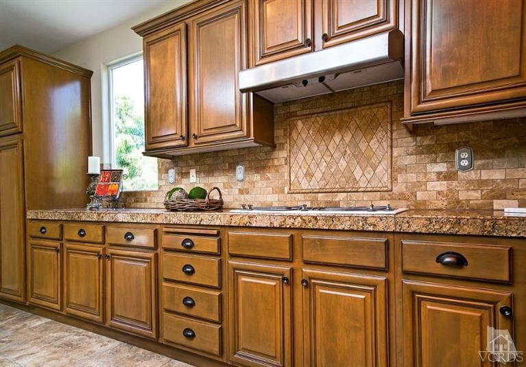 14303 Peach Hill Road Moorpark, CA 93021 - Photo 11 of 41 a kitchen with stainless steel appliances granite countertop a sink and cabinets